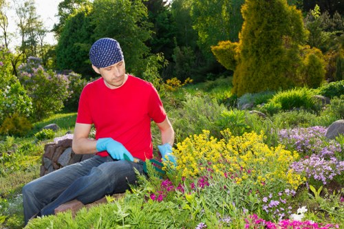 Site supervisor conducting a pre-start risk assessment in a garden